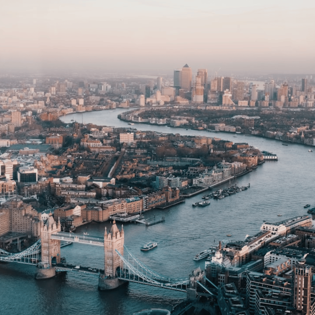 How to Obtain a Certificate of Incorporation in the UK: A Step-by-Step Guide 4 A person holding a Certificate of Incorporation in their hand, with a laptop displaying the Companies House website in the background.