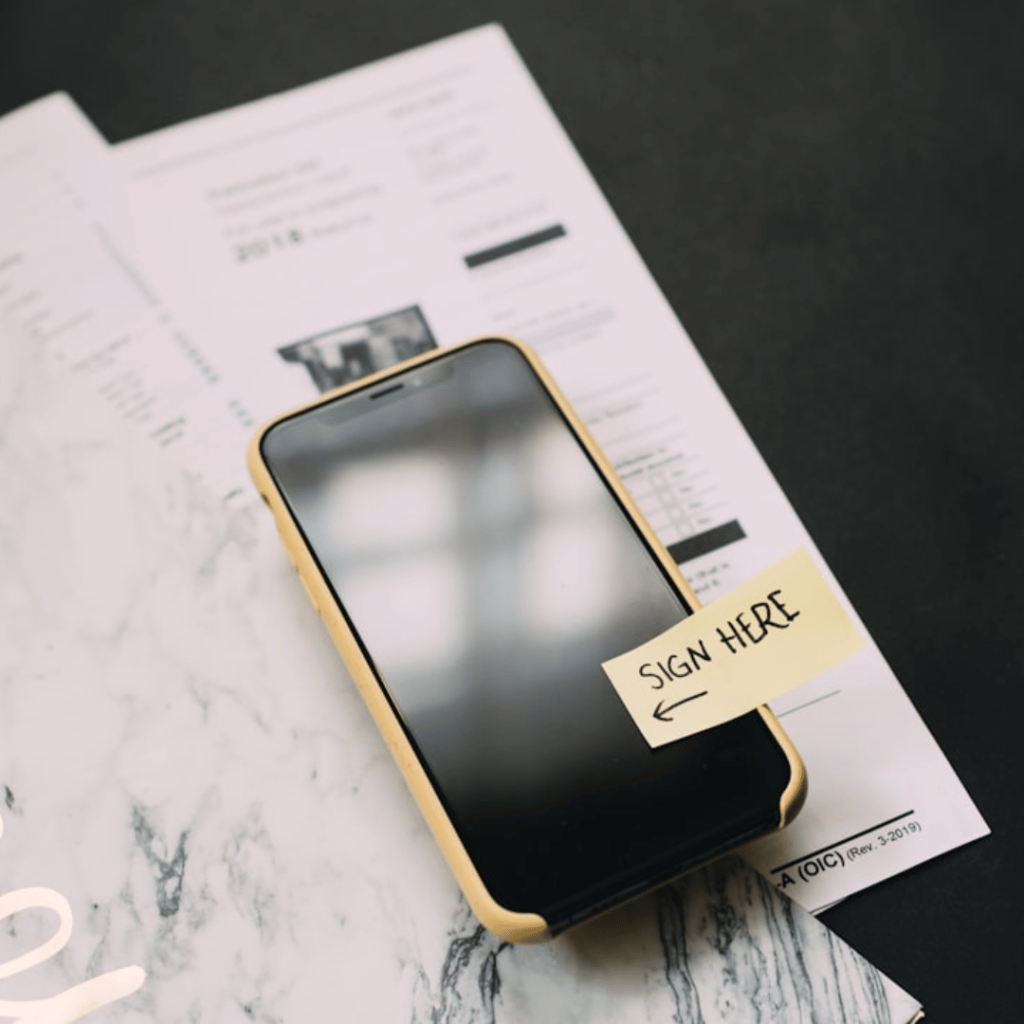 Verification of Identity Form (VIF) in Ireland: A Complete Guide 8 A person filling out a Verification of Identity Form (VIF) in Ireland, with supporting documents like a passport and driver's license.