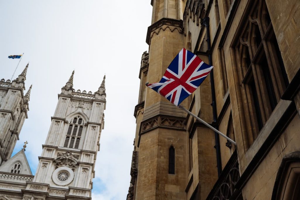 Common Questions About UK Apostille Certificates 5 Union Jack flag on historic UK government building, representing the official process of apostille certification in the United Kingdom.
