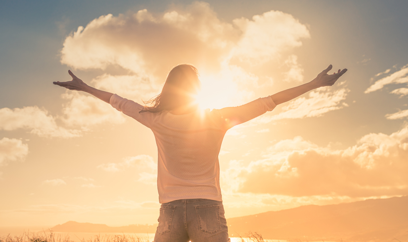 Navigating the Gender Recognition Certificate Process: A Complete Guide 1 Person embracing sunlight with open arms – symbol of legal gender recognition and personal freedom through Gender Recognition Certificate services by NotaryPublic24.com